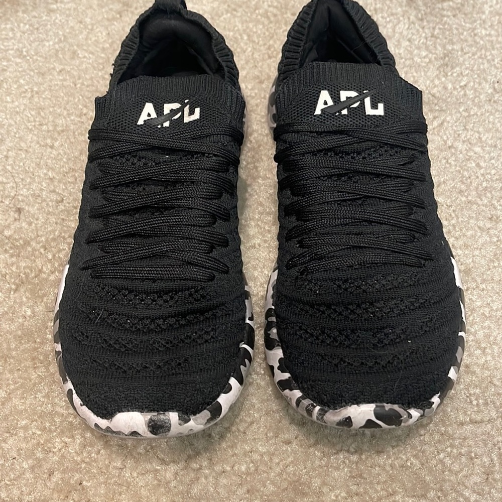 APL techloom sneakers, black with black and white leopard print at bottom.